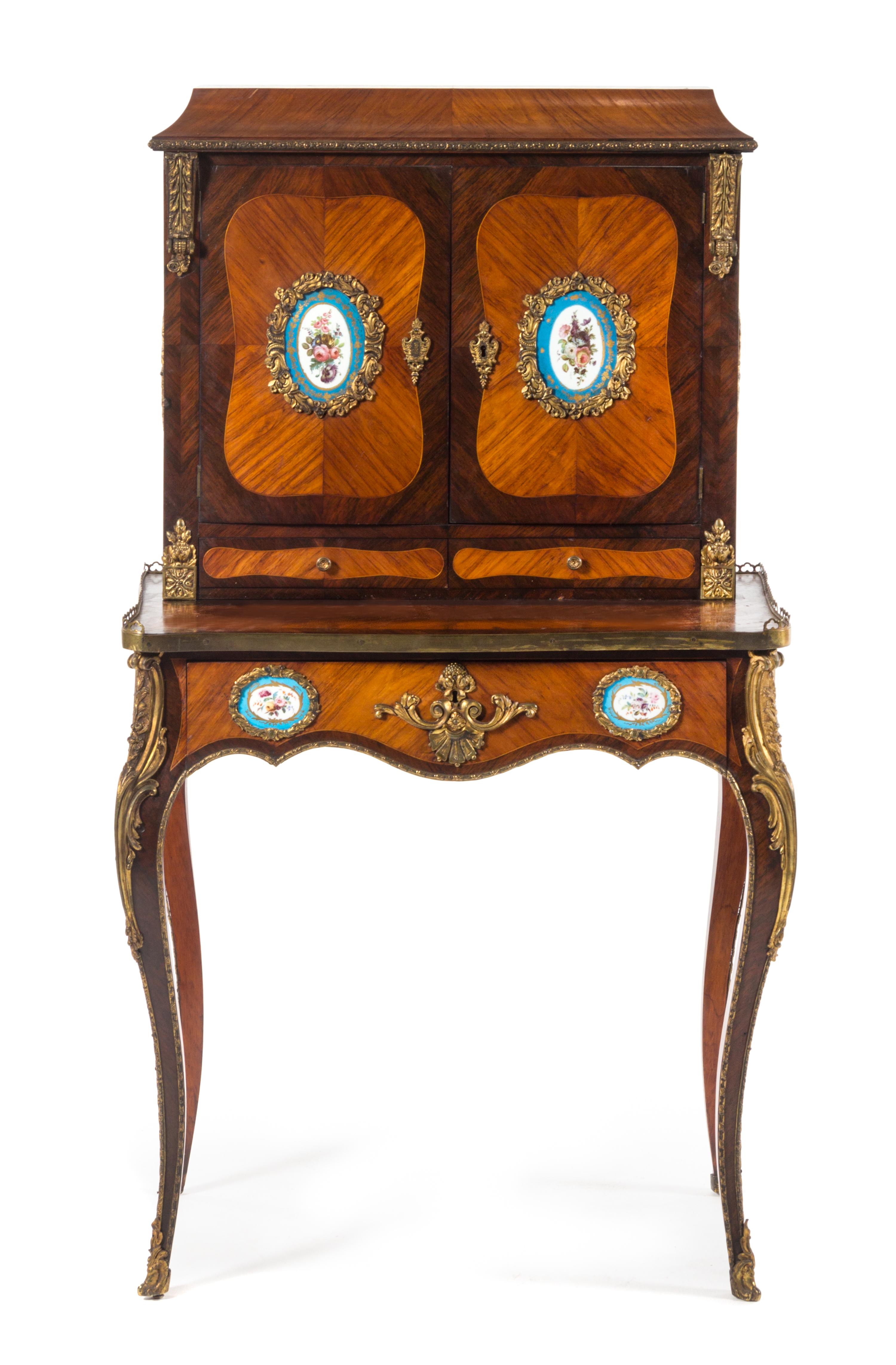 A Louis XV Style Gilt Bronze and Sevres Style Porcelain Mounted Kingwood and Tulipwood Bonheur du Jour Height 51 x width 28 1/4 x depth — 19TH CENTURY