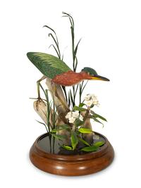 A Carved and Painted Shore Bird in Naturalistic Setting