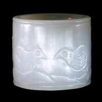 A Carved White Jade 'Double Quails' Archer's Ring