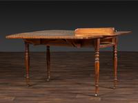 A Late Federal Figured Birch Drop Leaf Dining Table