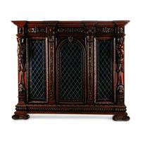 A Continental Renaissance Revival Carved Walnut and Leaded Glass Cabinet