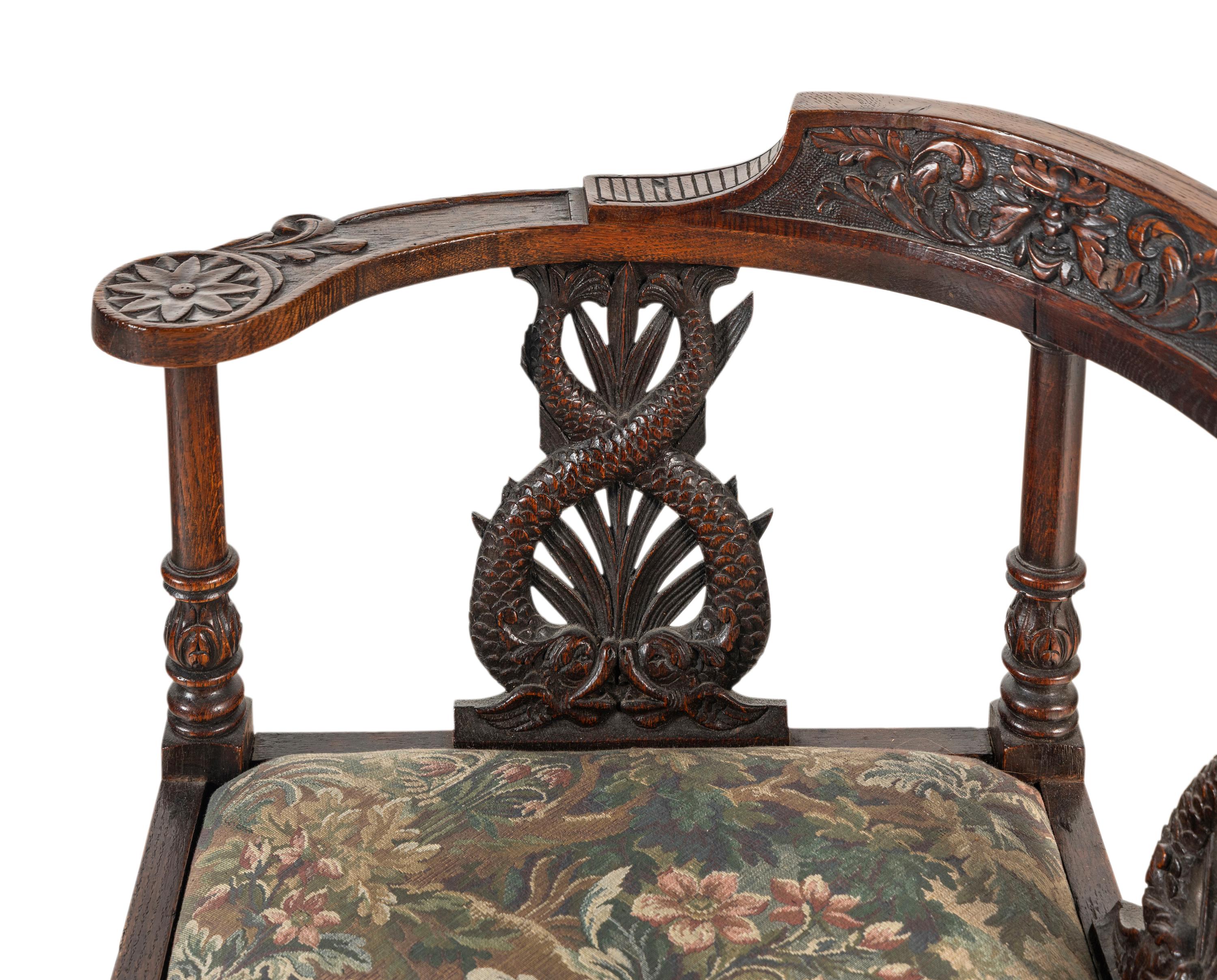 A Renaissance Revival Carved Oak Corner Chair