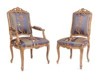 A Set of Twelve Louis XV Style Giltwood Dining Chairs