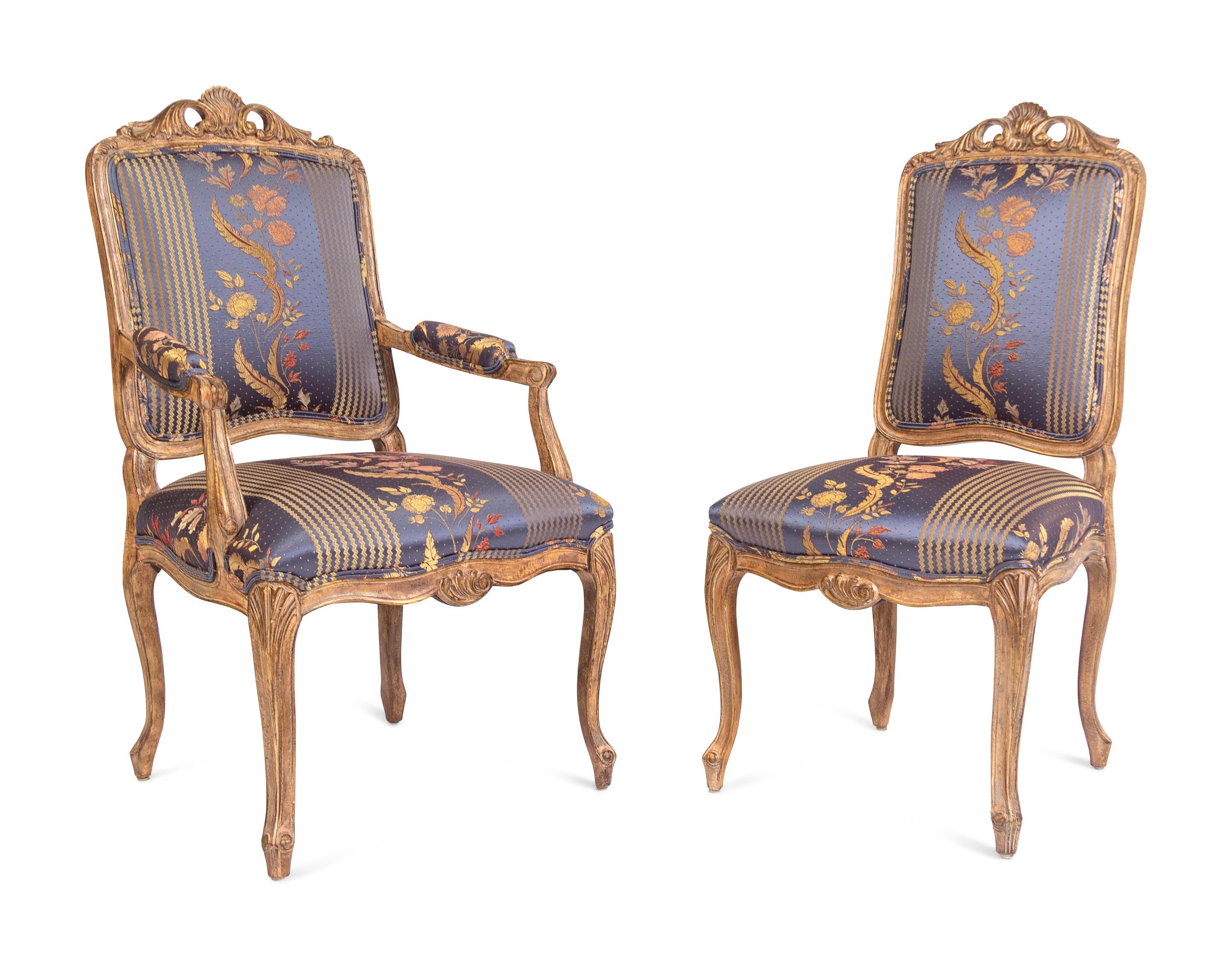 A Set of Twelve Louis XV Style Giltwood Dining Chairs