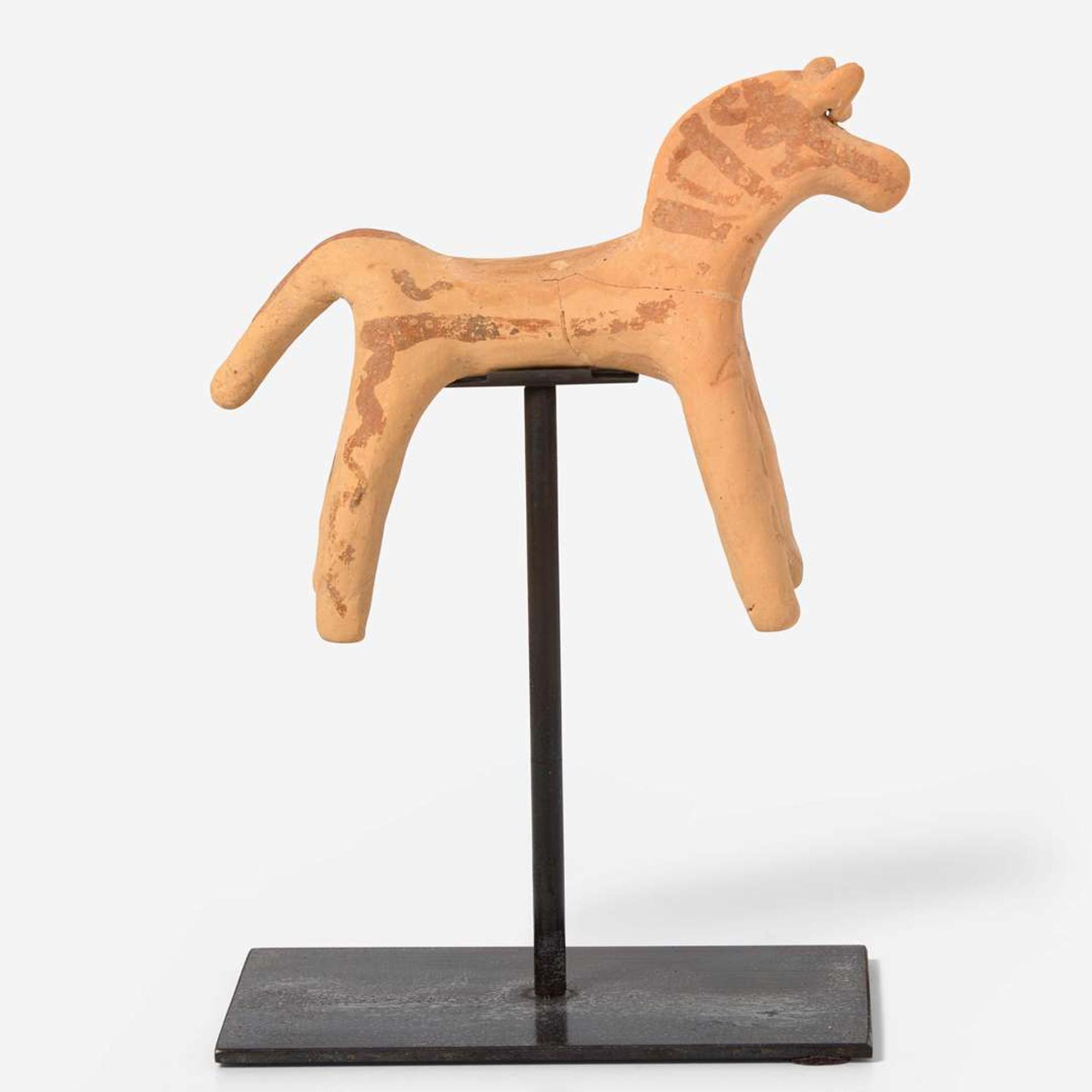 A Boeotian terracotta figure of a horse circa 6th century B.C.