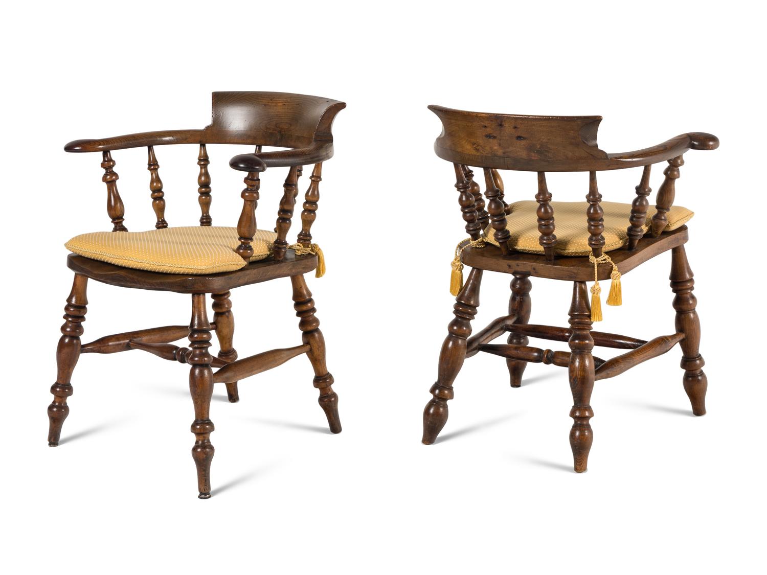 A Group of Four Oak Captain's Armchairs