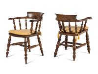 A Group of Four Oak Captain's Armchairs