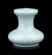 A Pale Celadon Glazed Molded Flower Pot