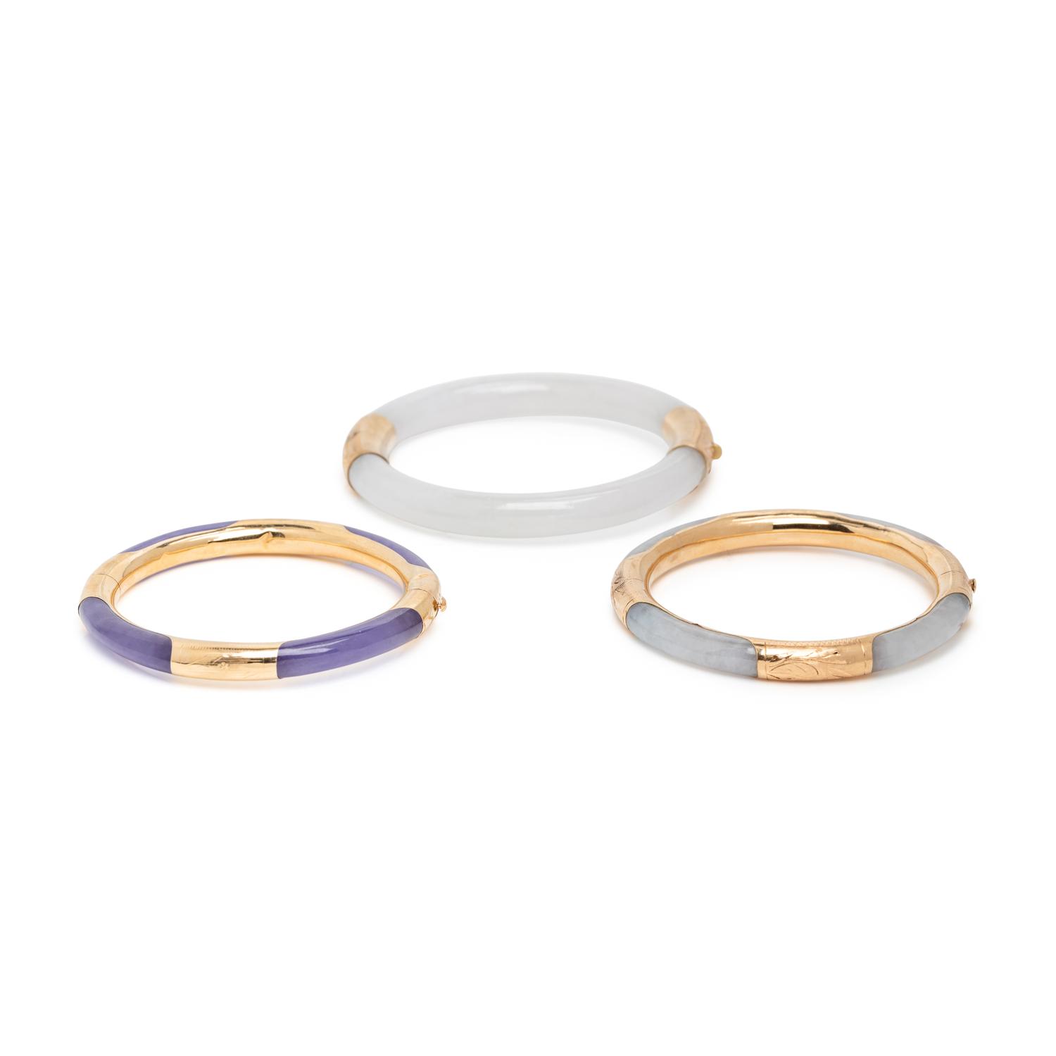 THREE JADE AND YELLOW GOLD BANGLE BRACELETS