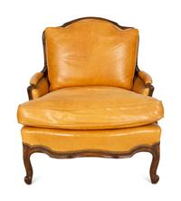 A Louis XVI Style Carved Mahogany Leather Upholstered Bergeré — 20th Century