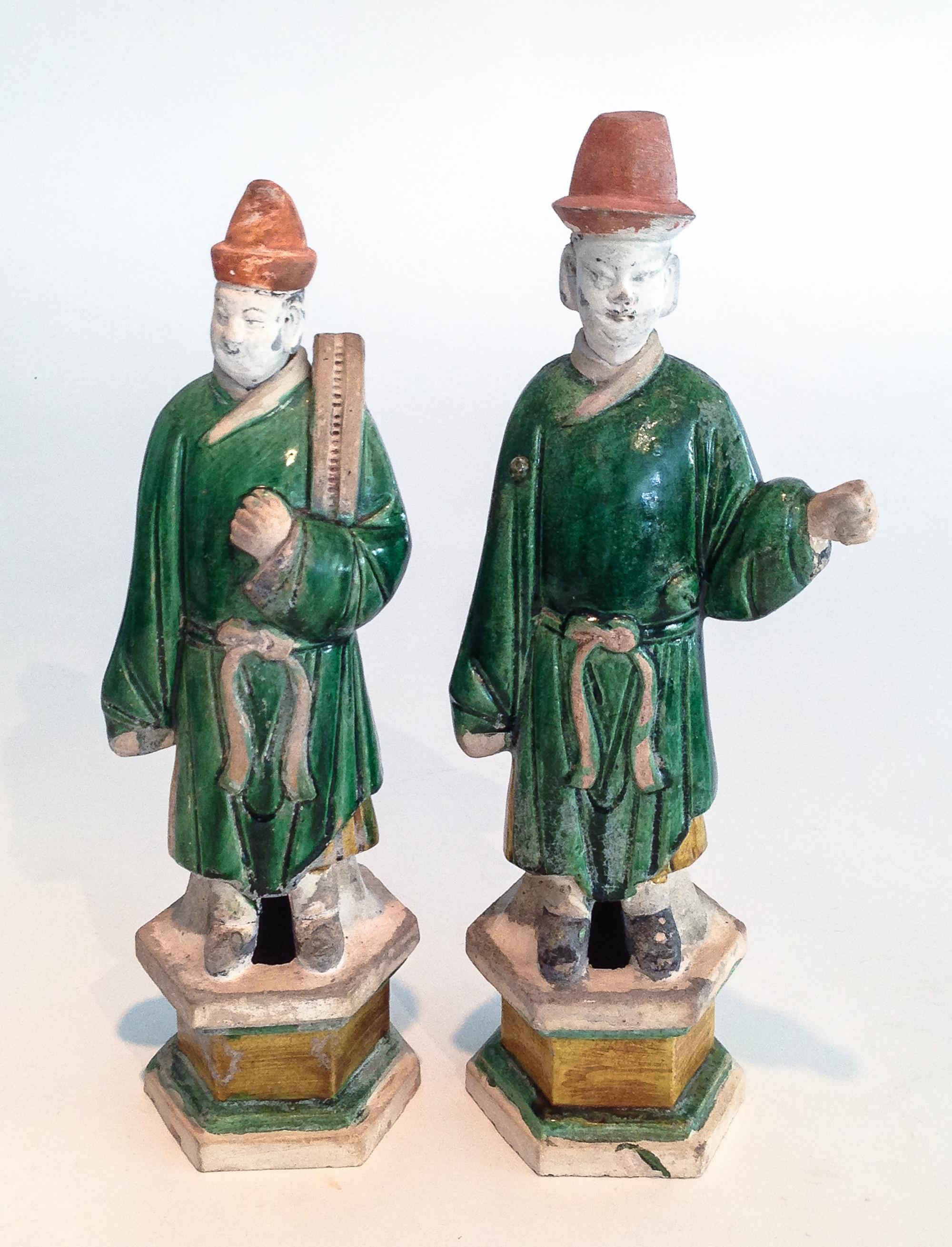 A Pair of Tang Style Partially Glazed Ceramic Figures Height of taller 15 3/4 inches.