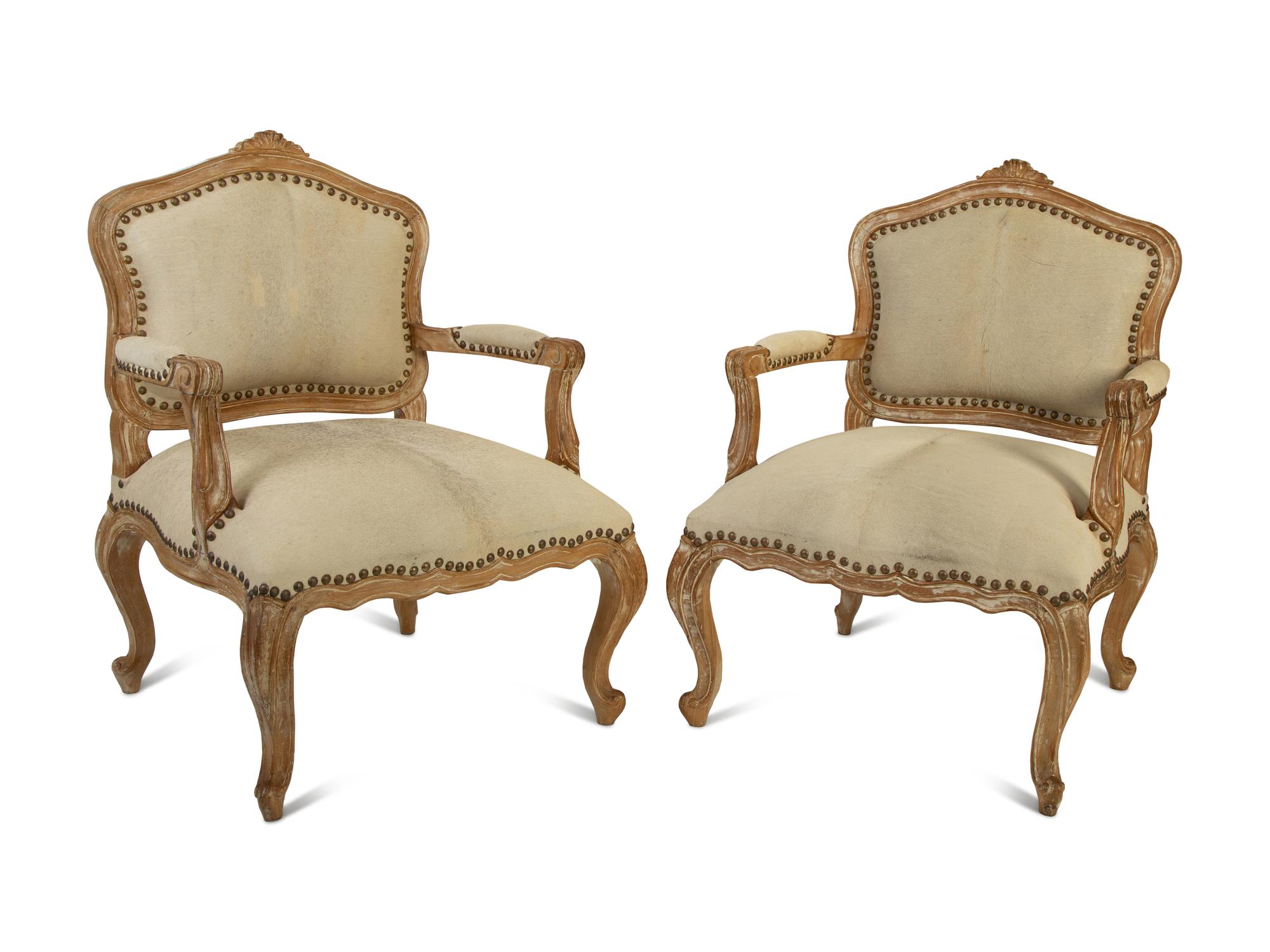 A Pair of French Provincial Fauteuils with Hide Upholstery — 20TH CENTURY