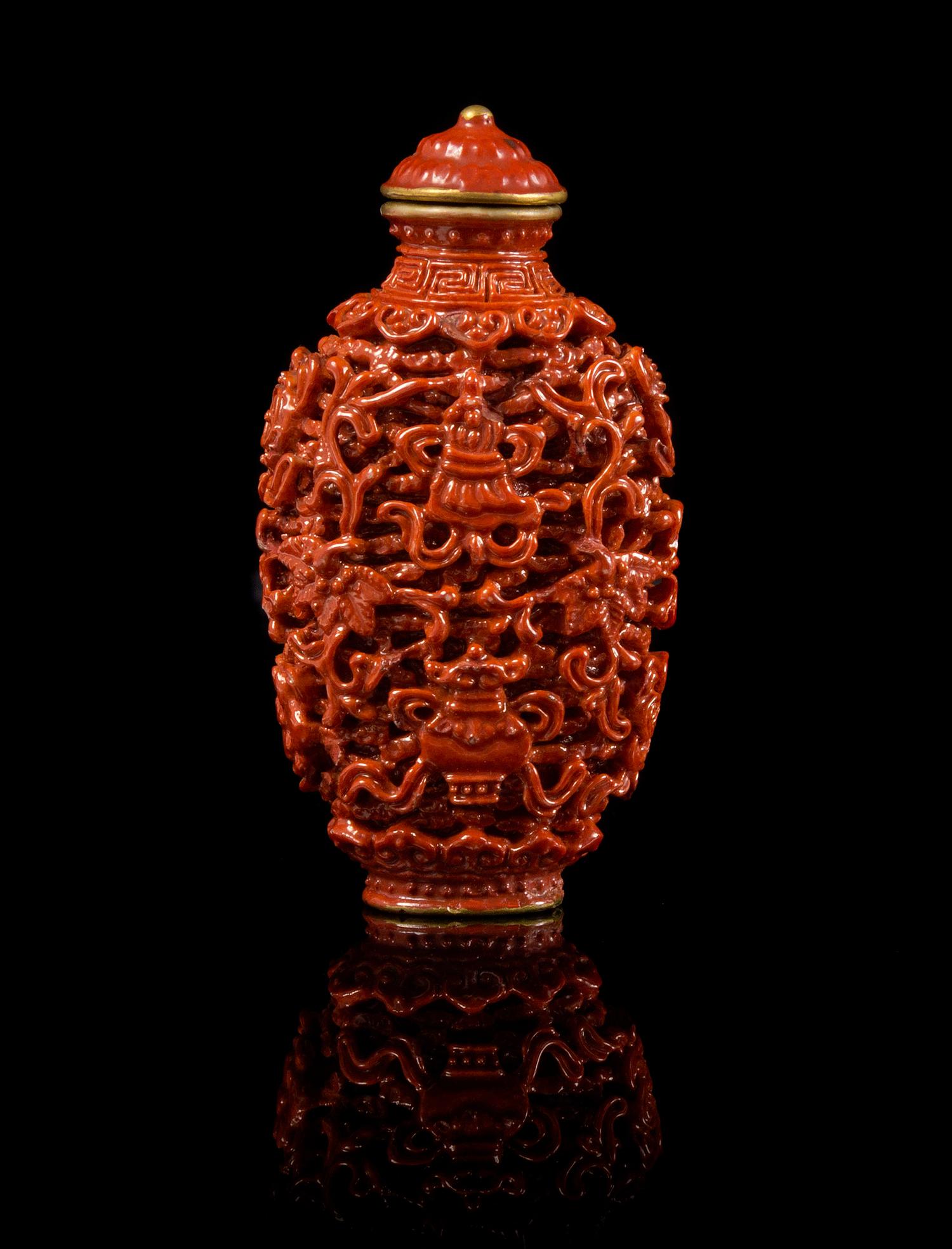 A Red Glazed Porcelain Imitating Cinnabar Snuff Bottle Height 3 3/8 inches.