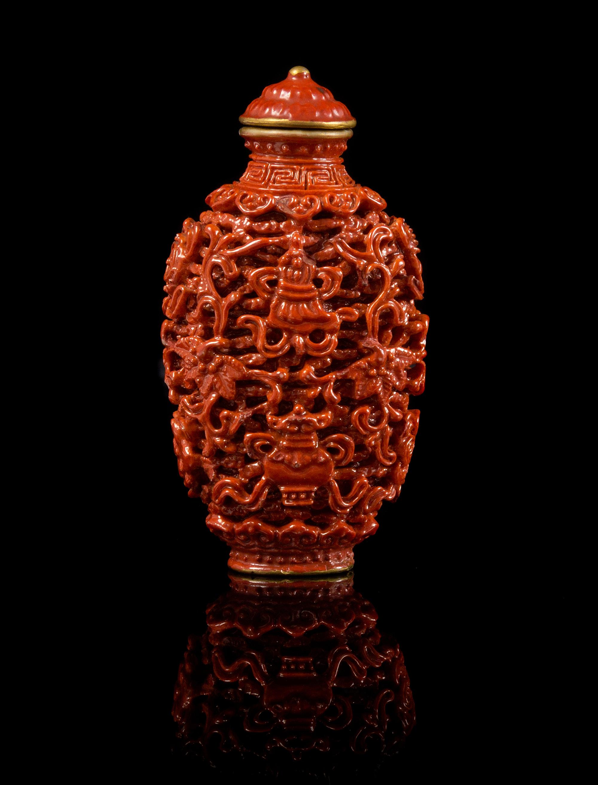 A Red Glazed Porcelain Imitating Cinnabar Snuff Bottle Height 3 3/8 inches.