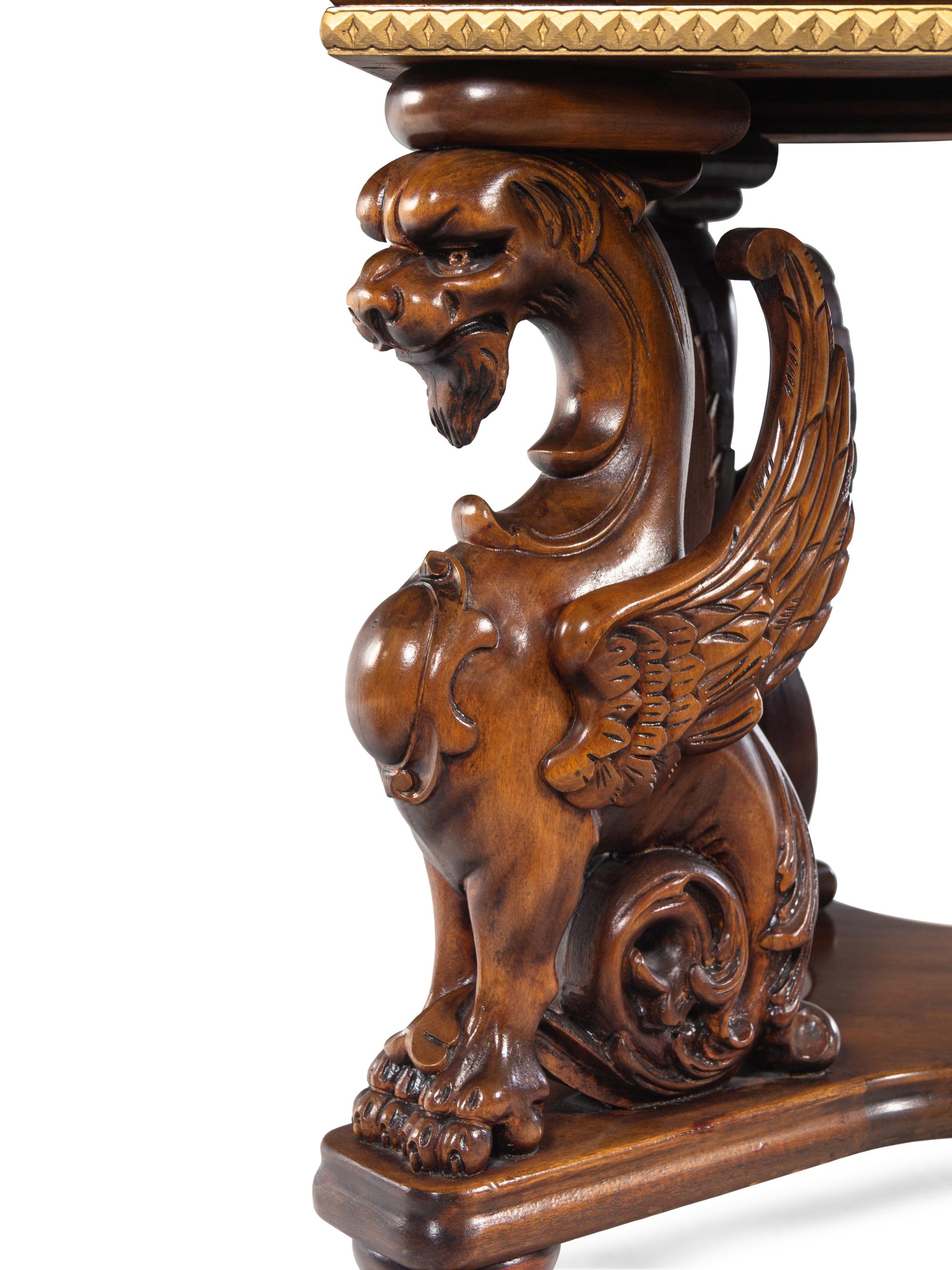 A Renaissance Revival Carved Walnut Library Table