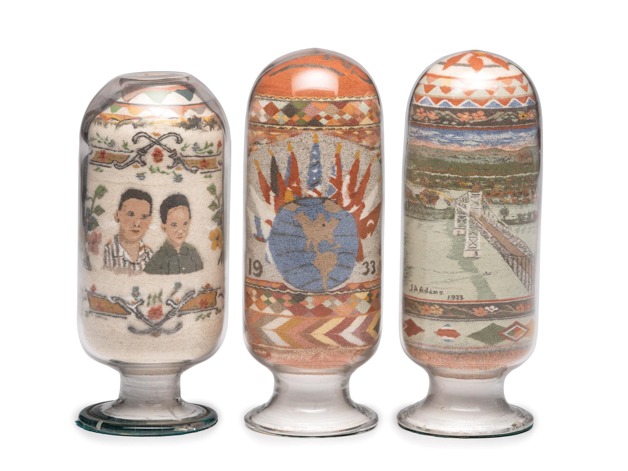 A Collection of John A. Adams Sand Art Bottles, Along with Custom Box and Unused Bottle