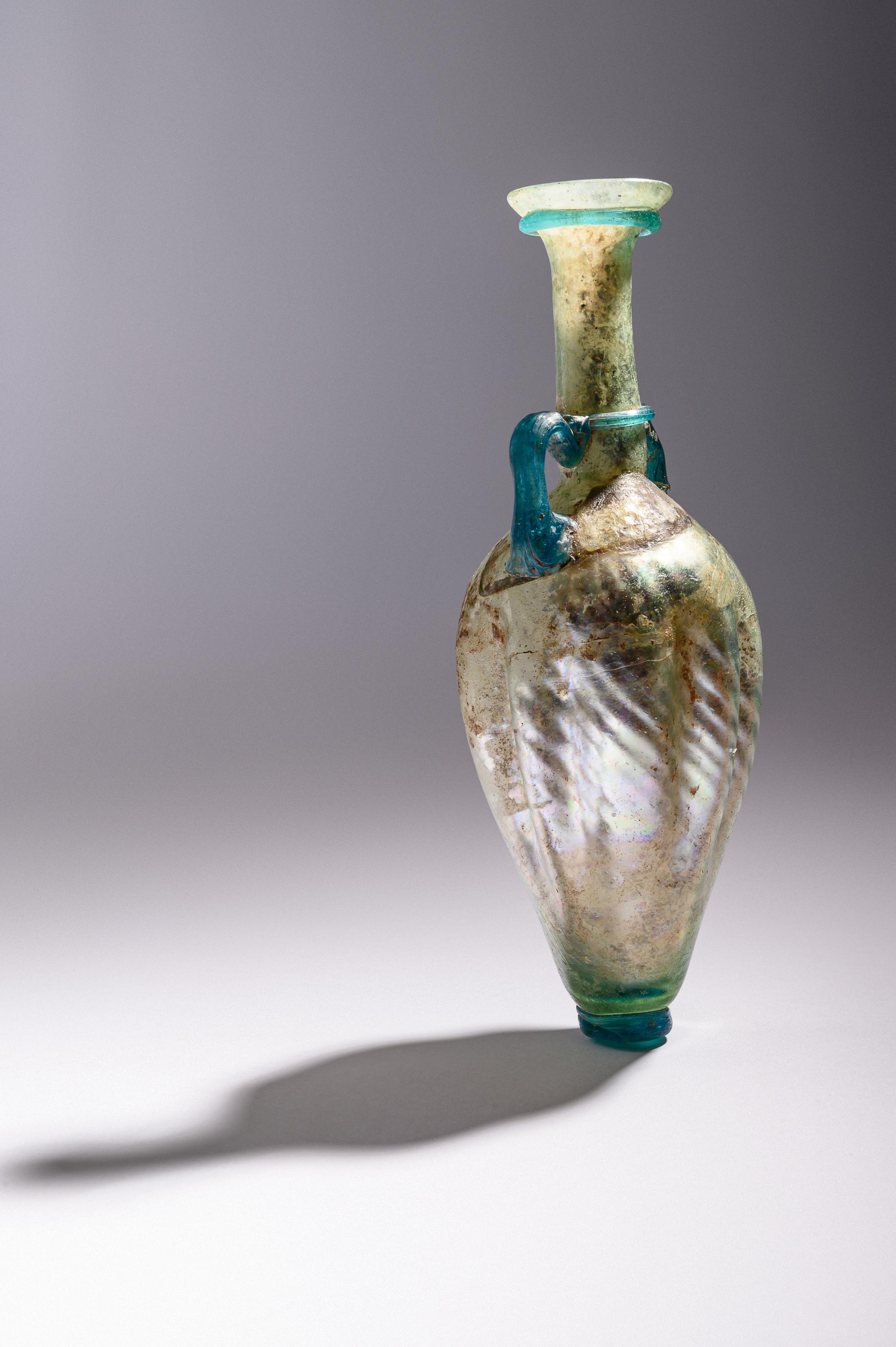 A Roman Glass Flask with Silver Iridescence