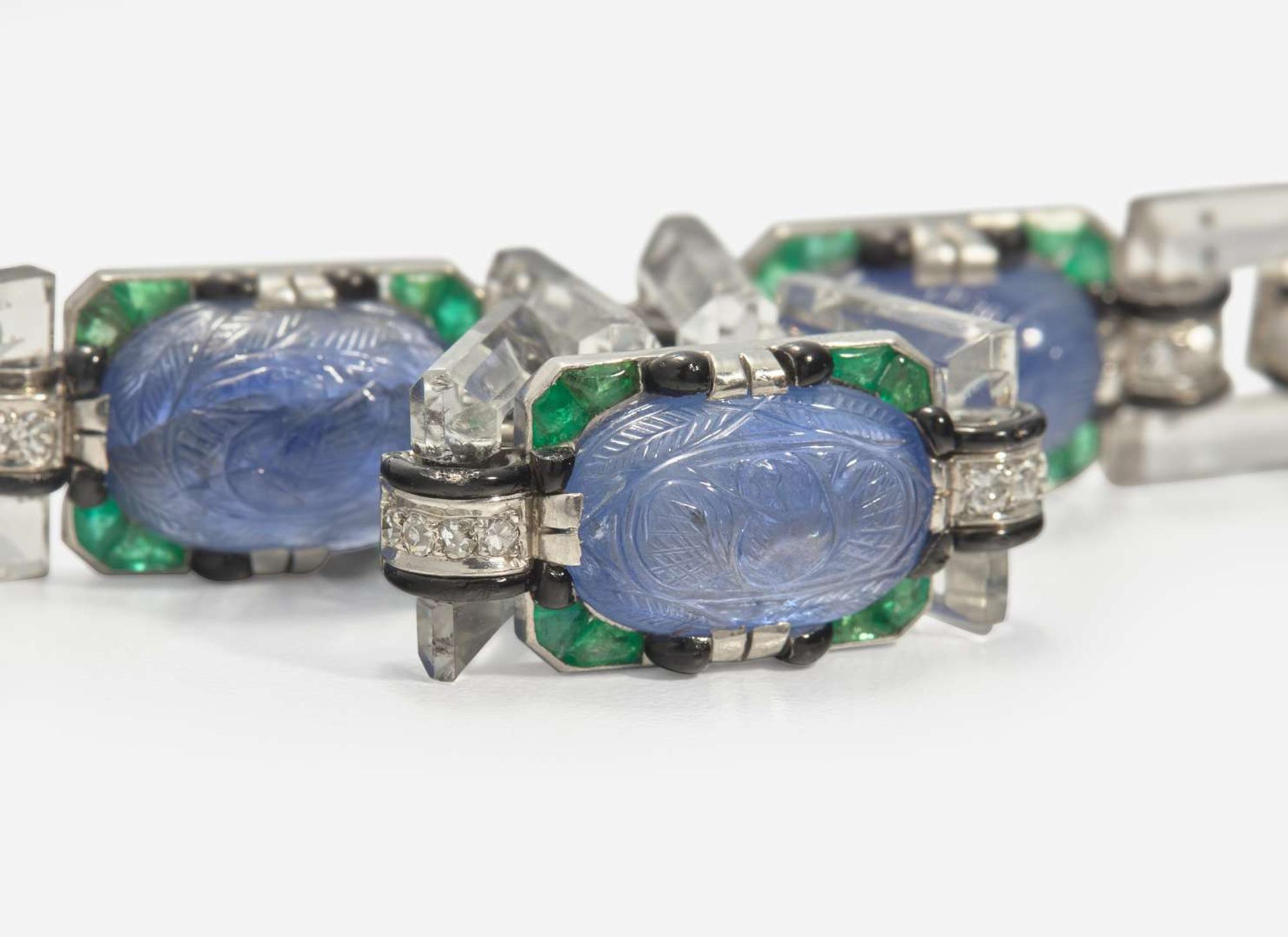 An 18K White Gold, Sapphire, Emerald, Diamond, and Enamel Art Deco Bracelet