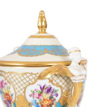 A Fürstenberg Porcelain Gilded Two-Handled Figural Urn