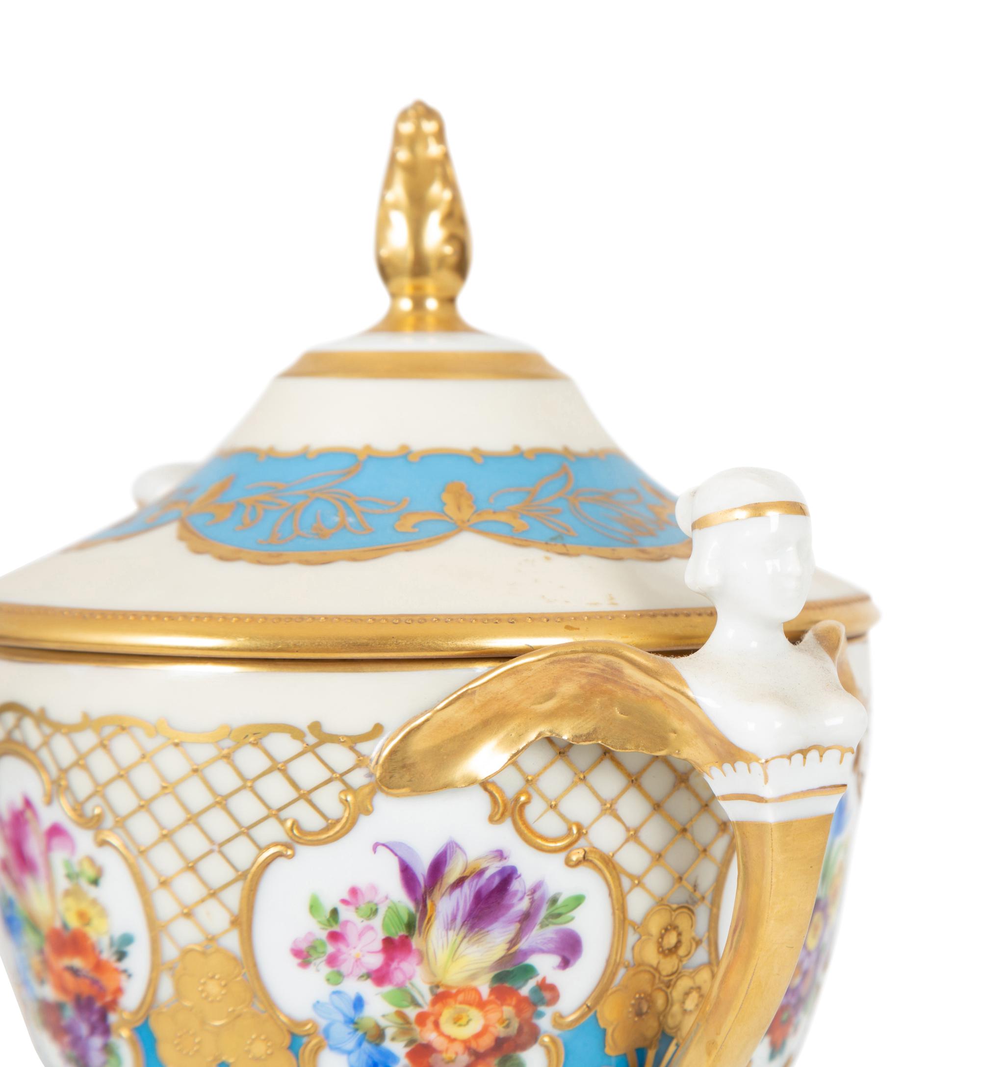 A Fürstenberg Porcelain Gilded Two-Handled Figural Urn