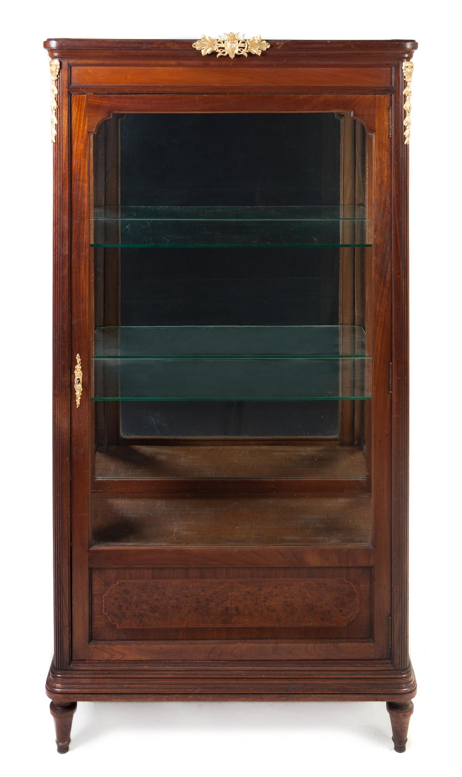 A Louis XVI Style Gilt Bronze Mounted Mahogany Vitrine, Height 70 1/4 x width 38 x depth 16 1/2 inches.