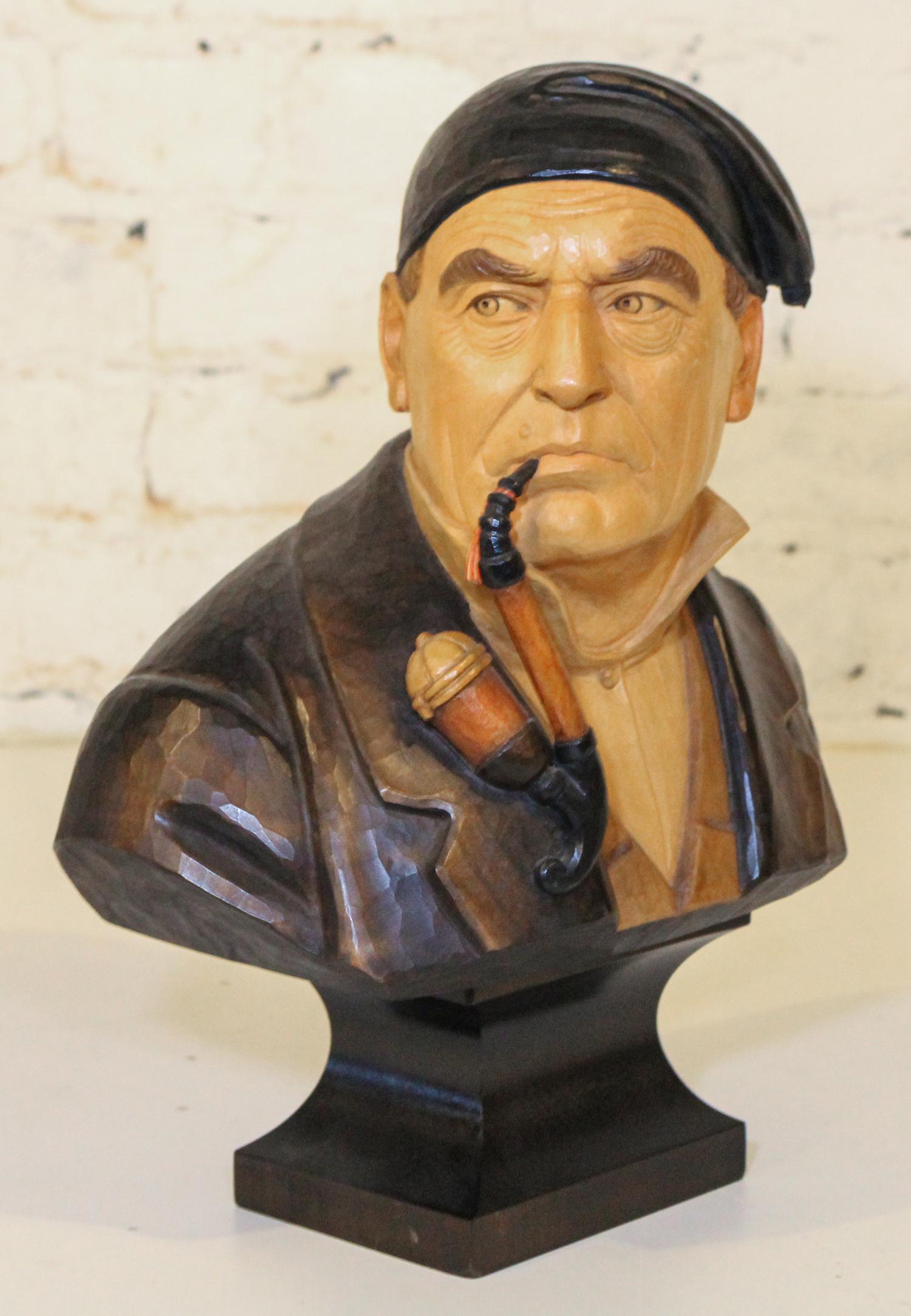 A Swiss Carved Wood and Polychrome Decorated Bust. Height 14 1/4 inches.
