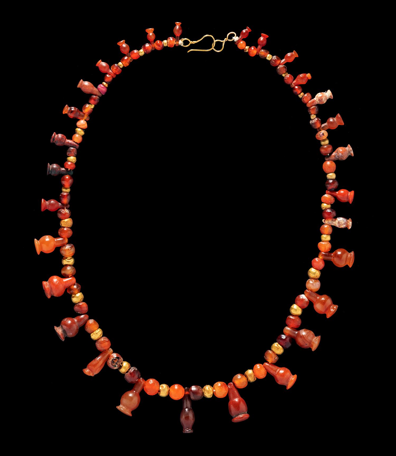 An Egyptian Carnelian and Red Jasper Bead Necklace