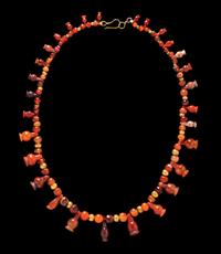 An Egyptian Carnelian and Red Jasper Bead Necklace