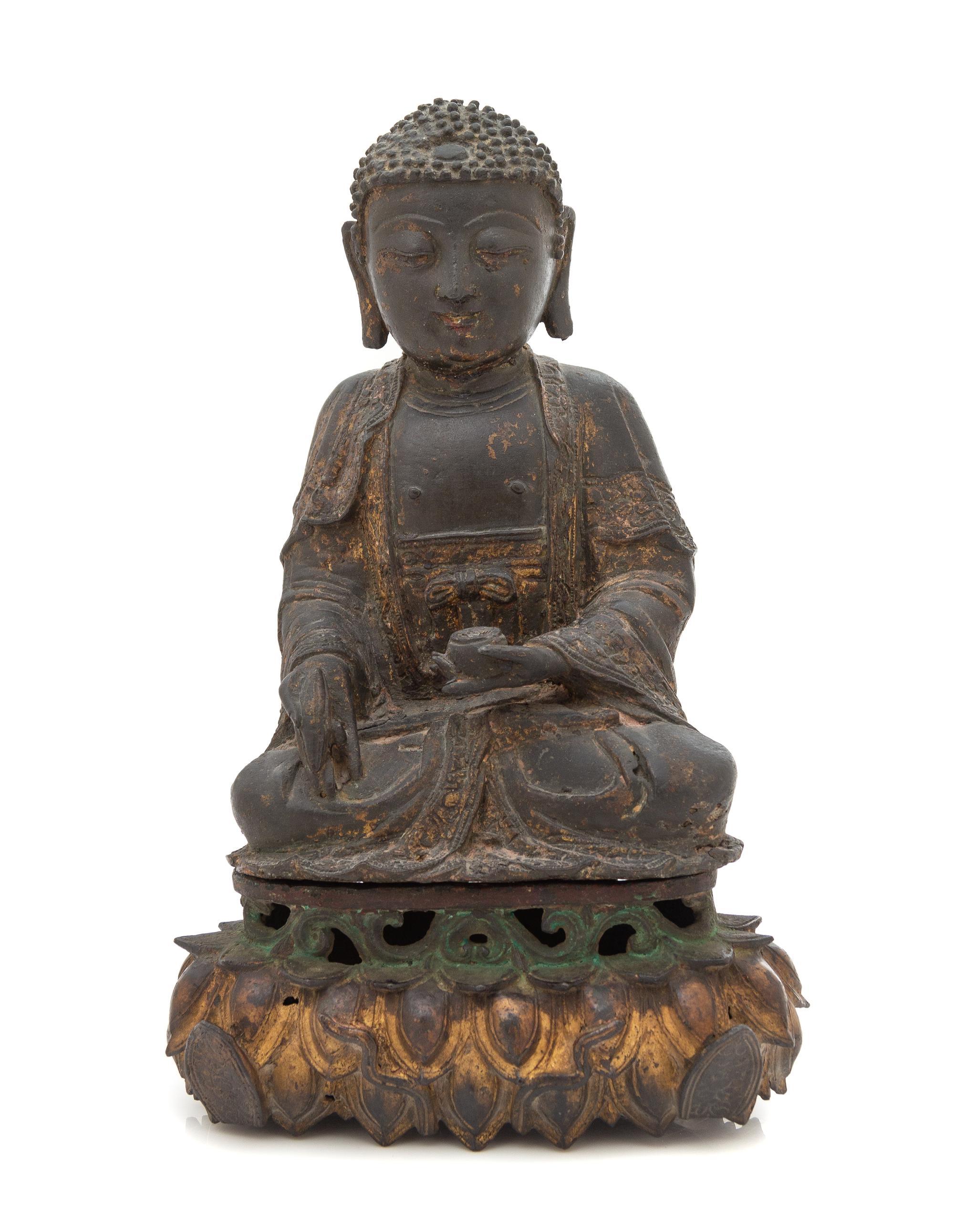 A Parcel Gilt Bronze Figure of Shakyamuni Buddha Height 12 inches. — MING DYNASTY (1368-1644)