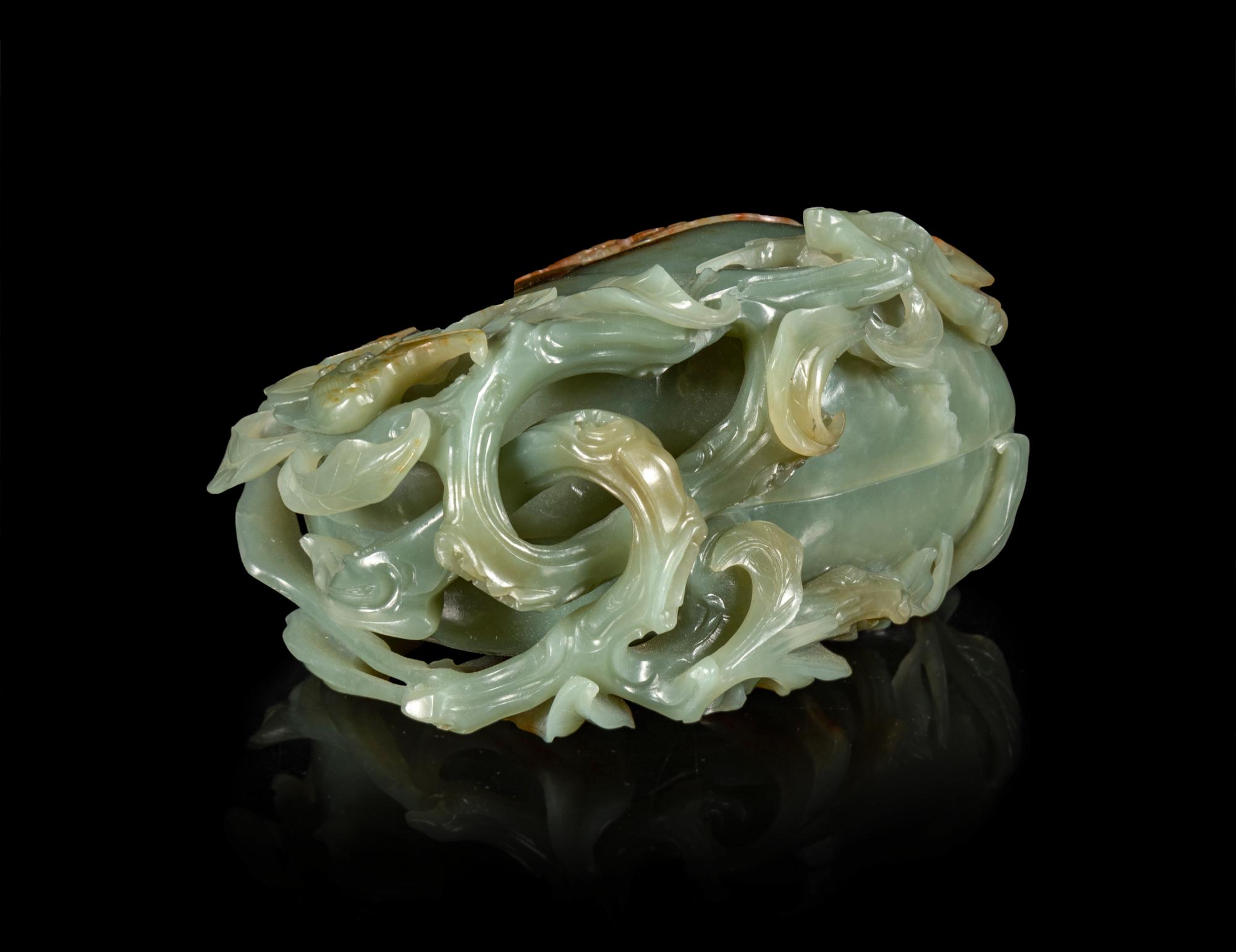A Russet and Celadon Jade 'Peach and Bat' Covered Box