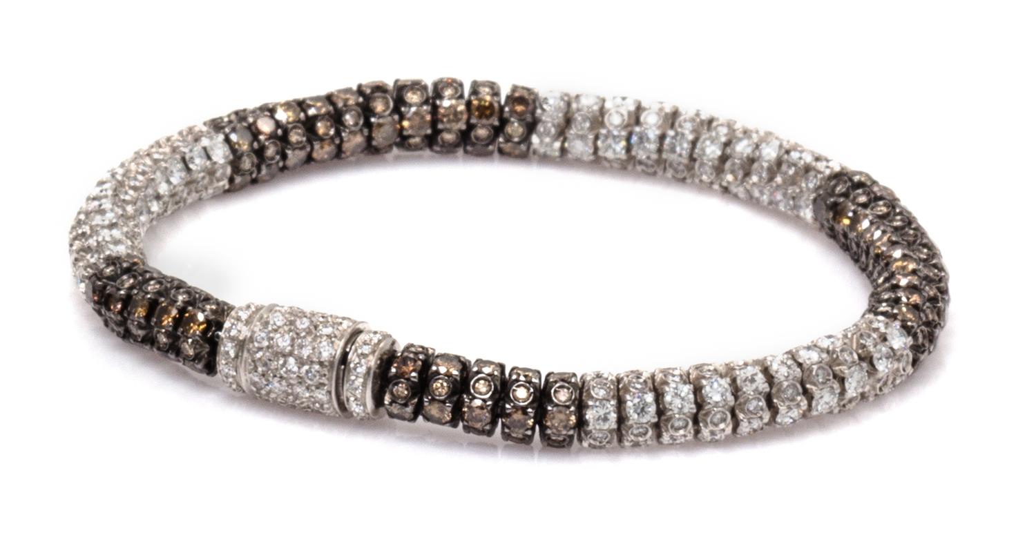 An 18 Karat White Gold, Colored Diamond and Diamond Bracelet, 18.00 dwts.