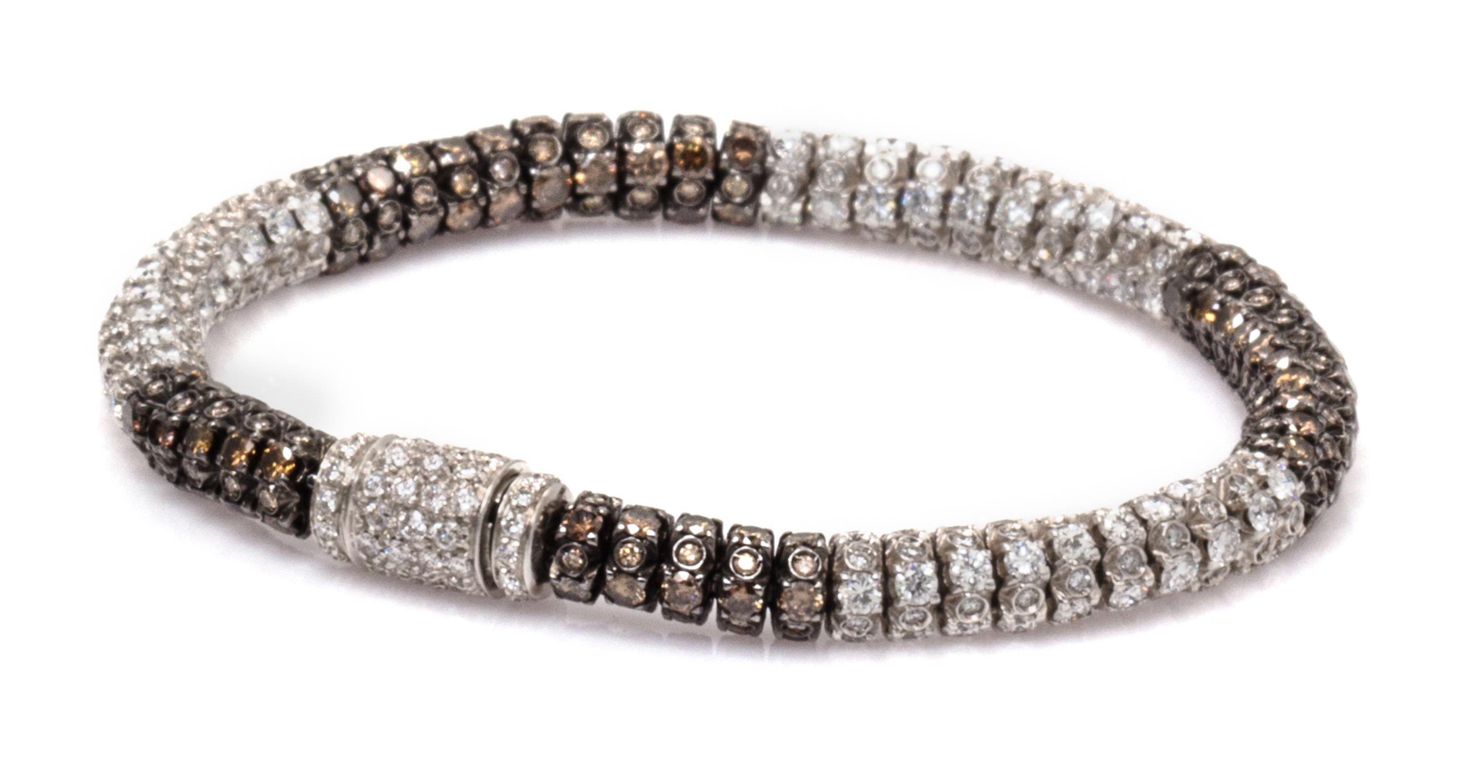 An 18 Karat White Gold, Colored Diamond and Diamond Bracelet, 18.00 dwts.