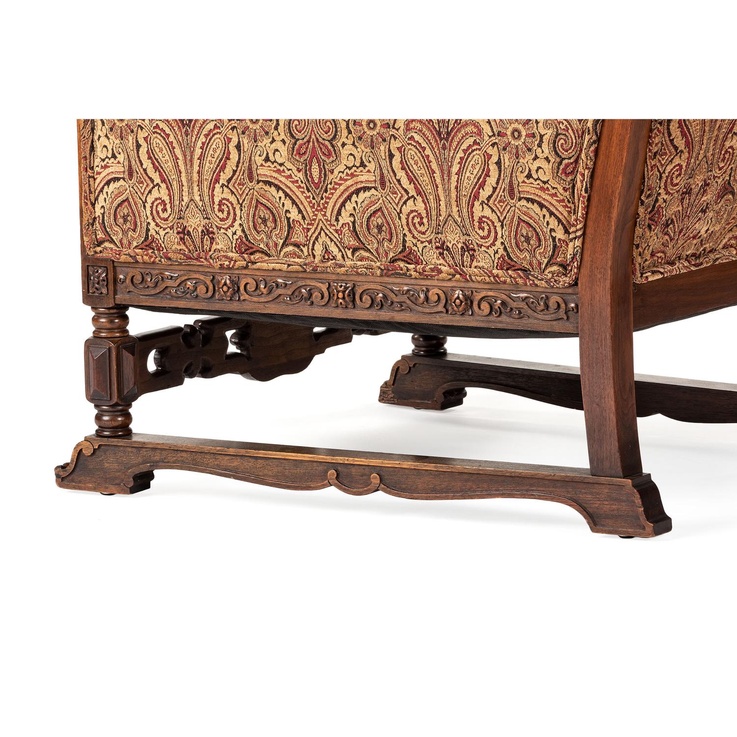 A Jacobean Style Carved Oak Sofa and Armchair