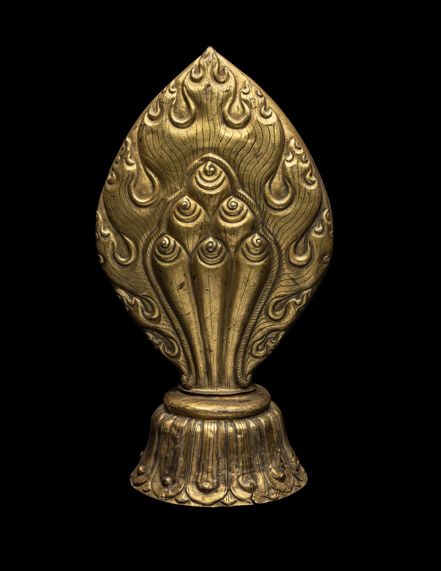 A Nepalese Repoussé Gilt Bronze Flaming Jewel Altar Piece