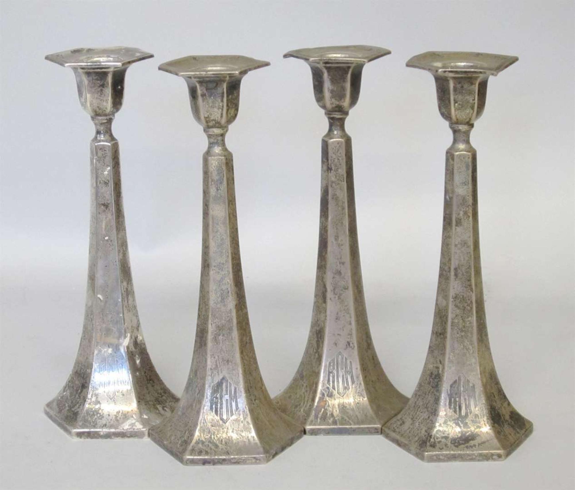 Two pair of sterling silver weighted candlesticks 20th century