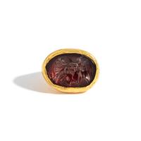A Greek Gold and Garnet Finger Ring with the Goddess Isis