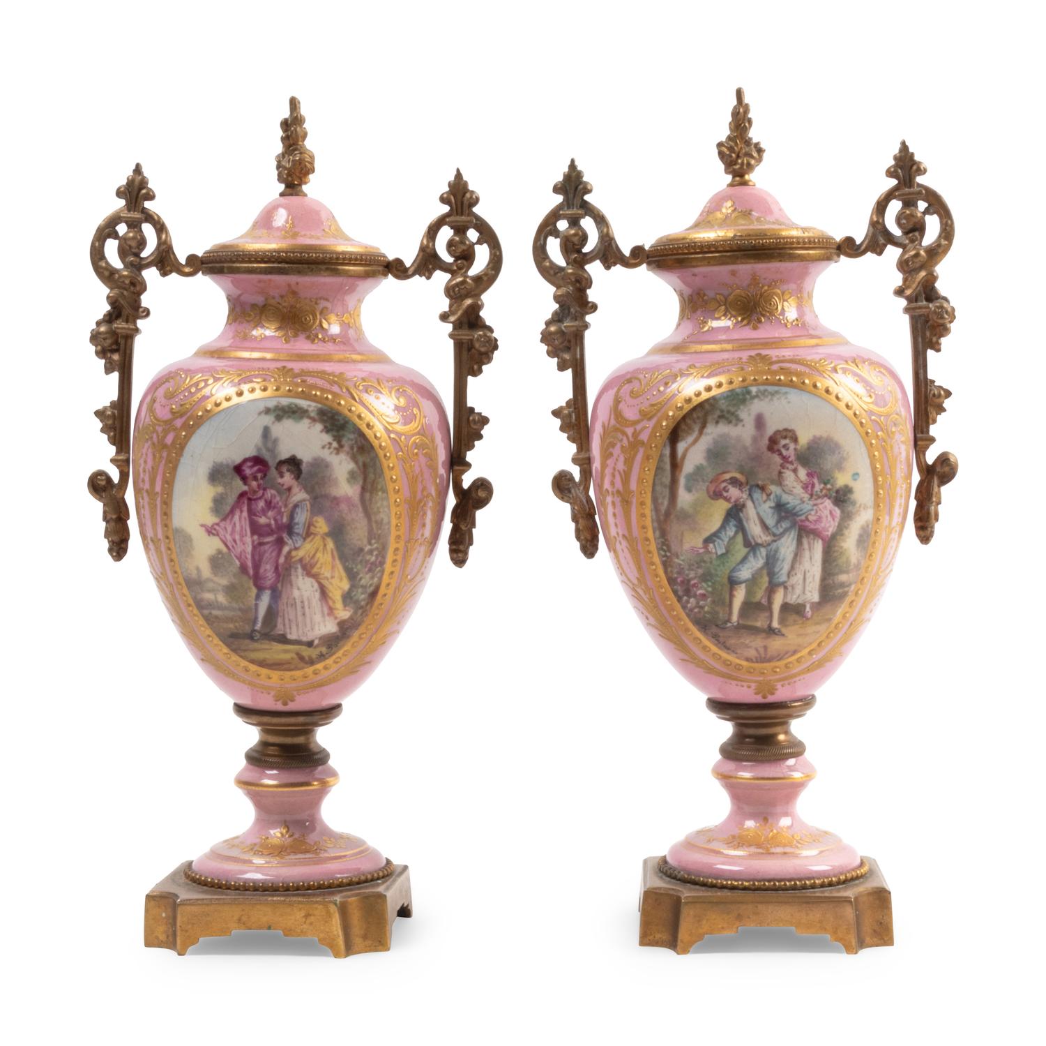 A Pair of Gilt Bronze Mounted Sèvres Style Porcelain Covered Urns