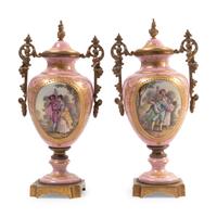A Pair of Gilt Bronze Mounted Sèvres Style Porcelain Covered Urns