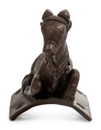 A Small Indian Bronze Figure of a Recumbent Bull