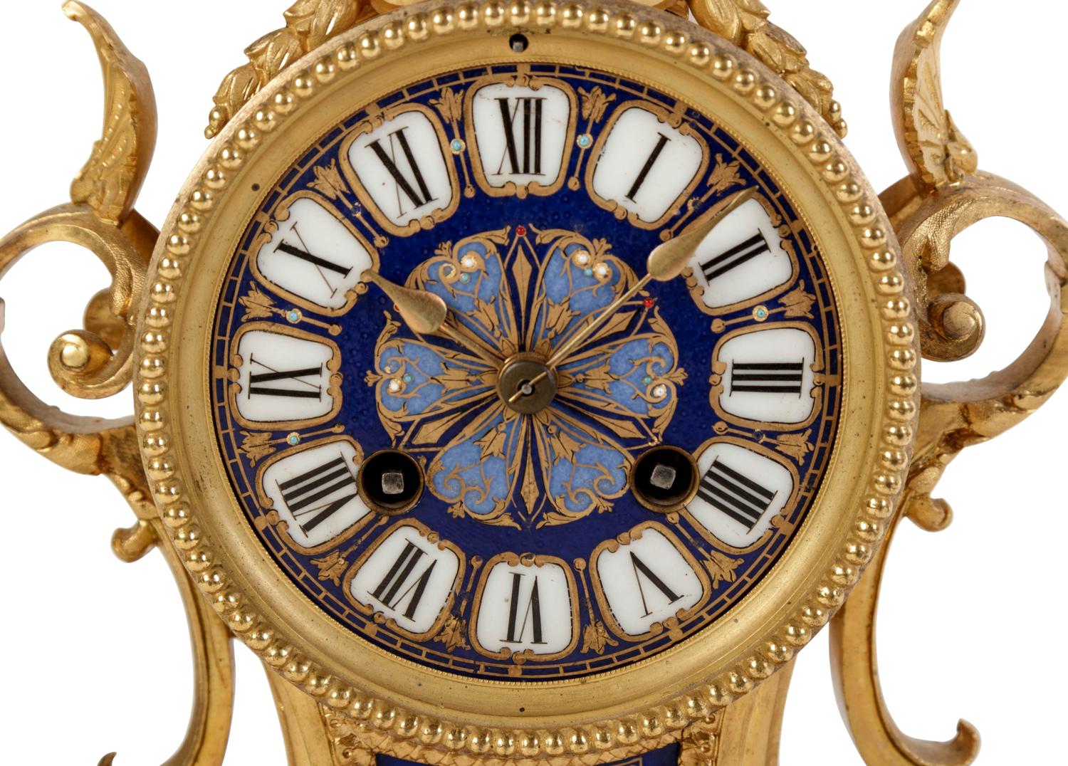 A Louis XVI Style Porcelain Inset Gilt Bronze Mantel Clock