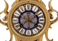 A Louis XVI Style Porcelain Inset Gilt Bronze Mantel Clock