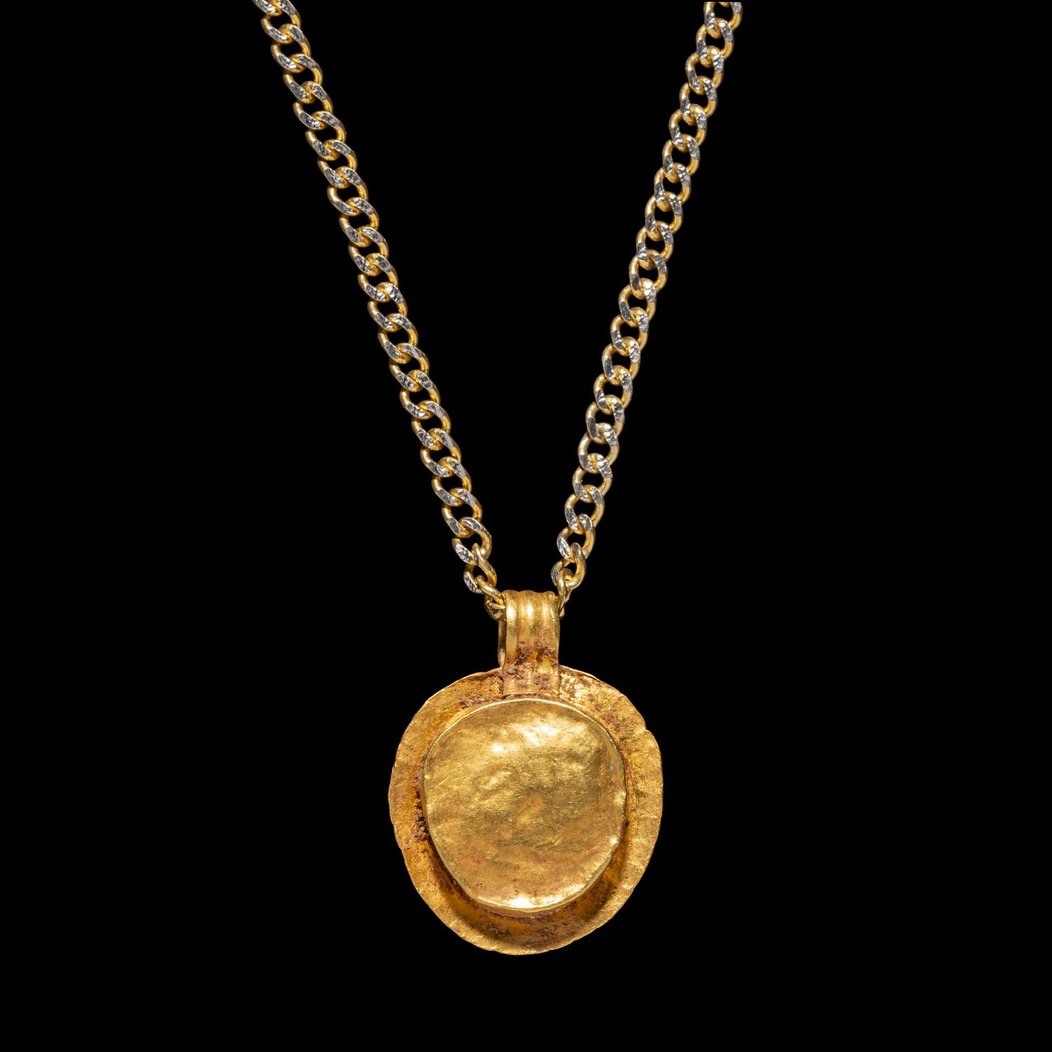 A Roman Gold and Onyx Cameo Pendant with Medusa — with a modern gold chain