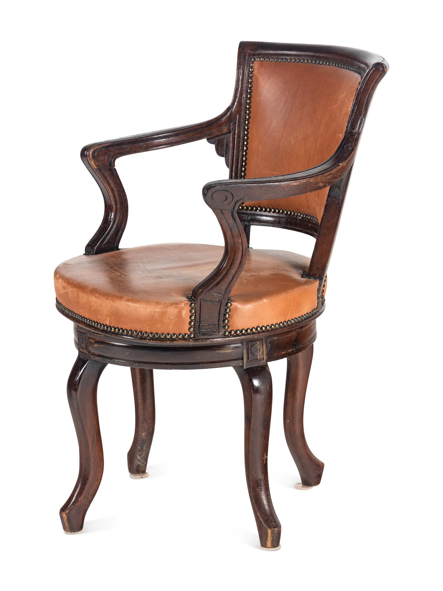 A Directoire Style Leather-Upholstered Swiveling Armchair