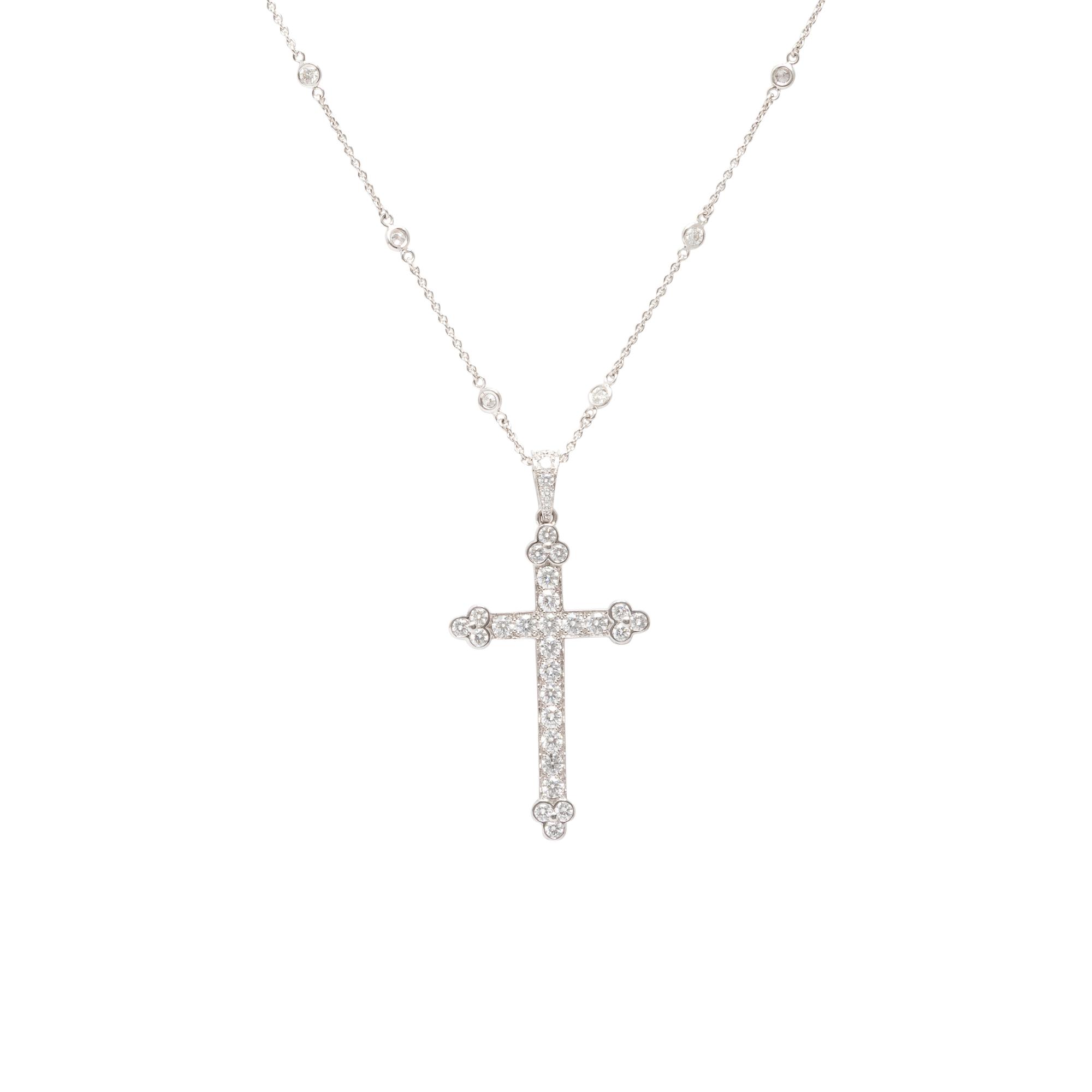 Cartier, Diamond and White Gold Cross Pendant with a Roberto Coin Diamond Station Chain Necklace