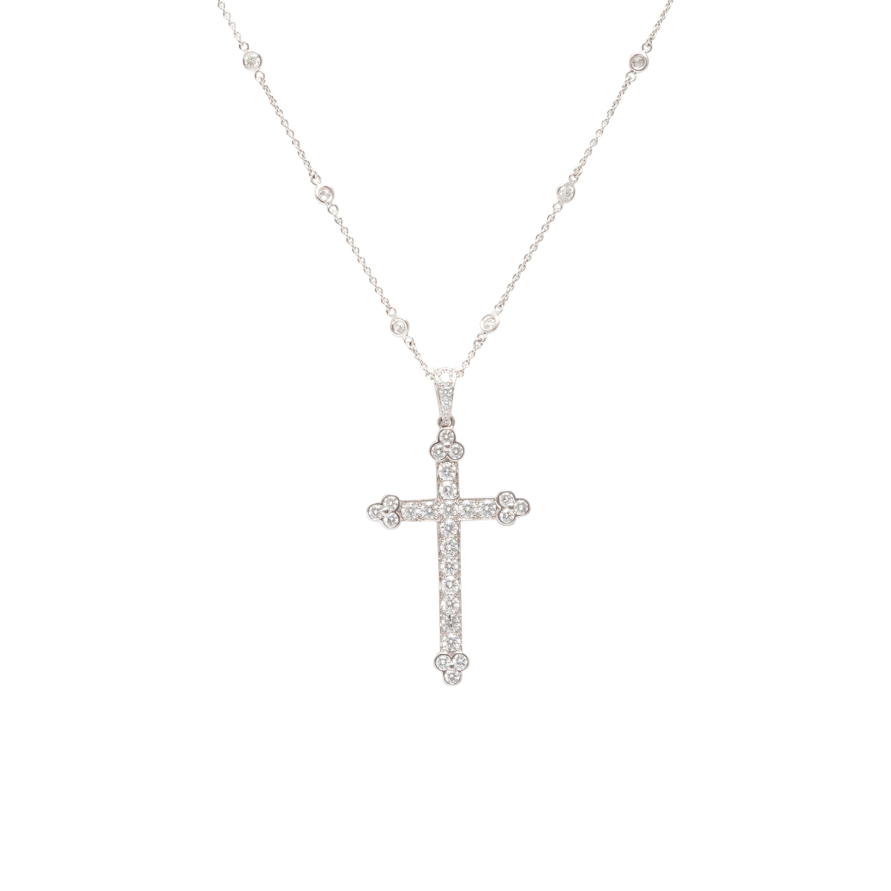 Cartier, Diamond and White Gold Cross Pendant with a Roberto Coin Diamond Station Chain Necklace
