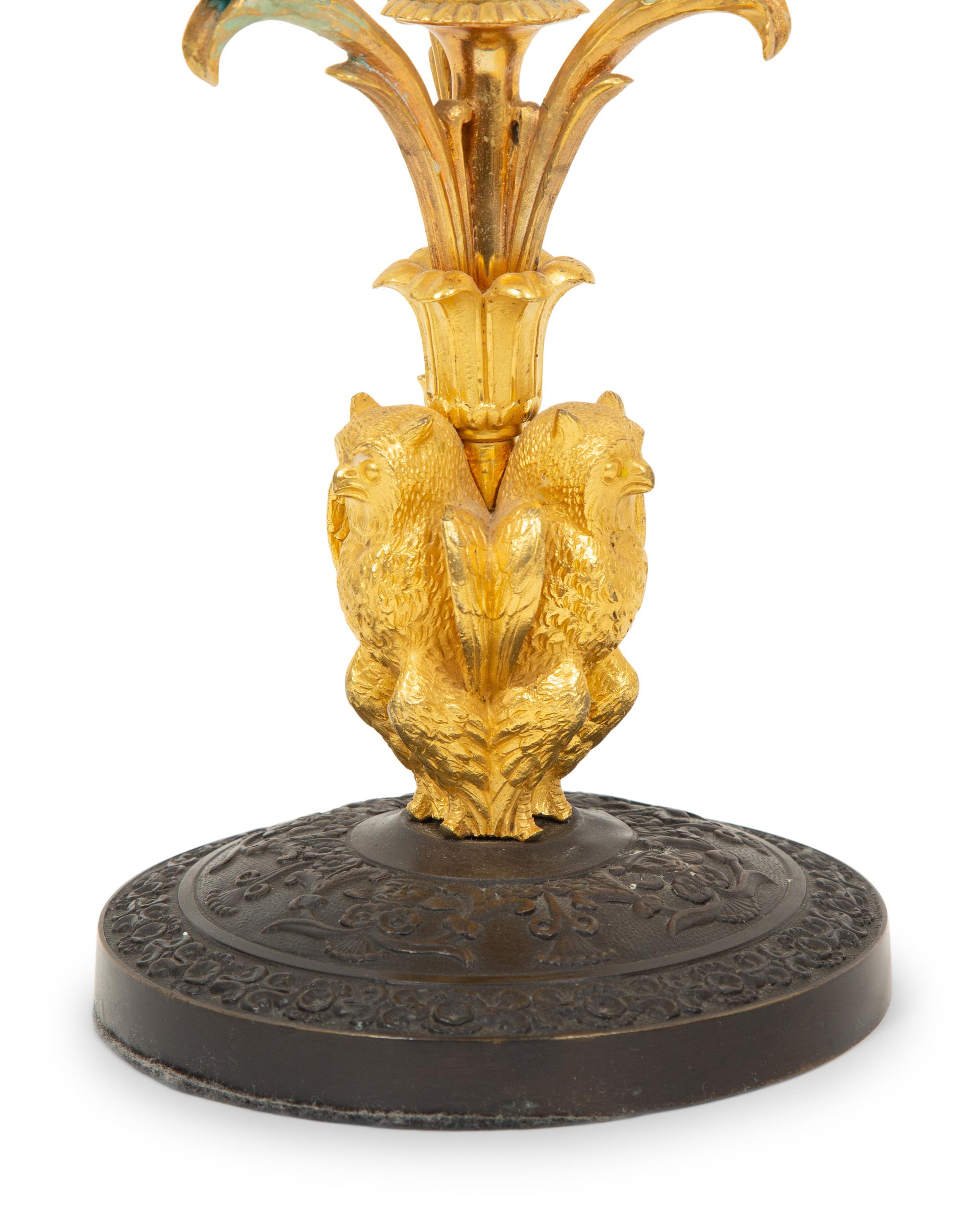 A Pair of Empire Style Gilt and Patinated Bronze Three-Light Candelabra