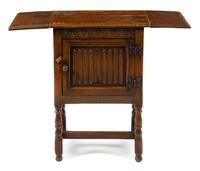 A Gothic Revival Oak Drop-Leaf Cabinet Height 30 3/8 x width 38 (open) x depth 14 1/4 inches. — 19TH CENTURY