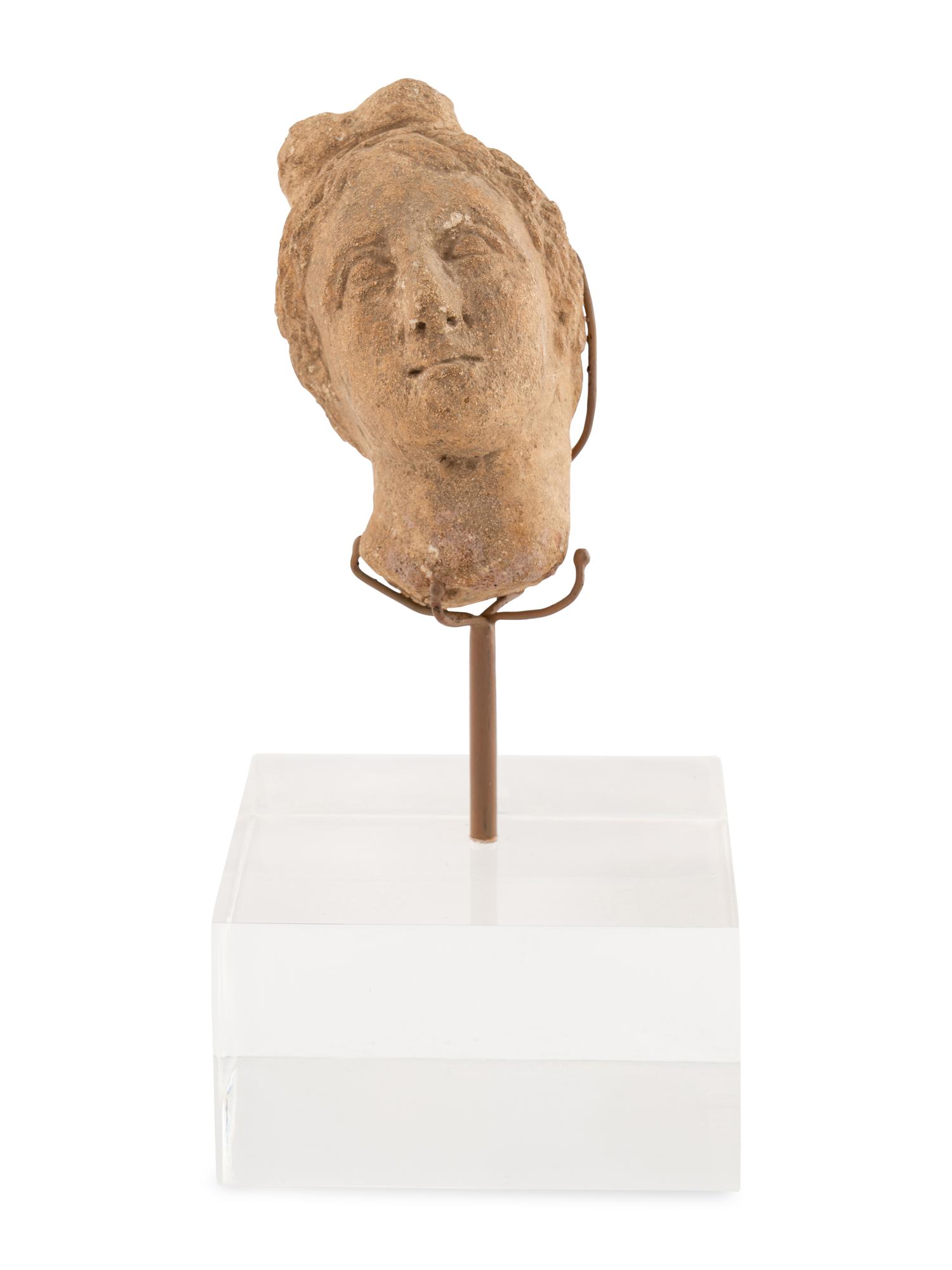 A Roman Stone Head of a Woman