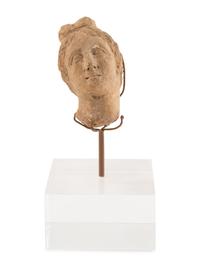 A Roman Stone Head of a Woman