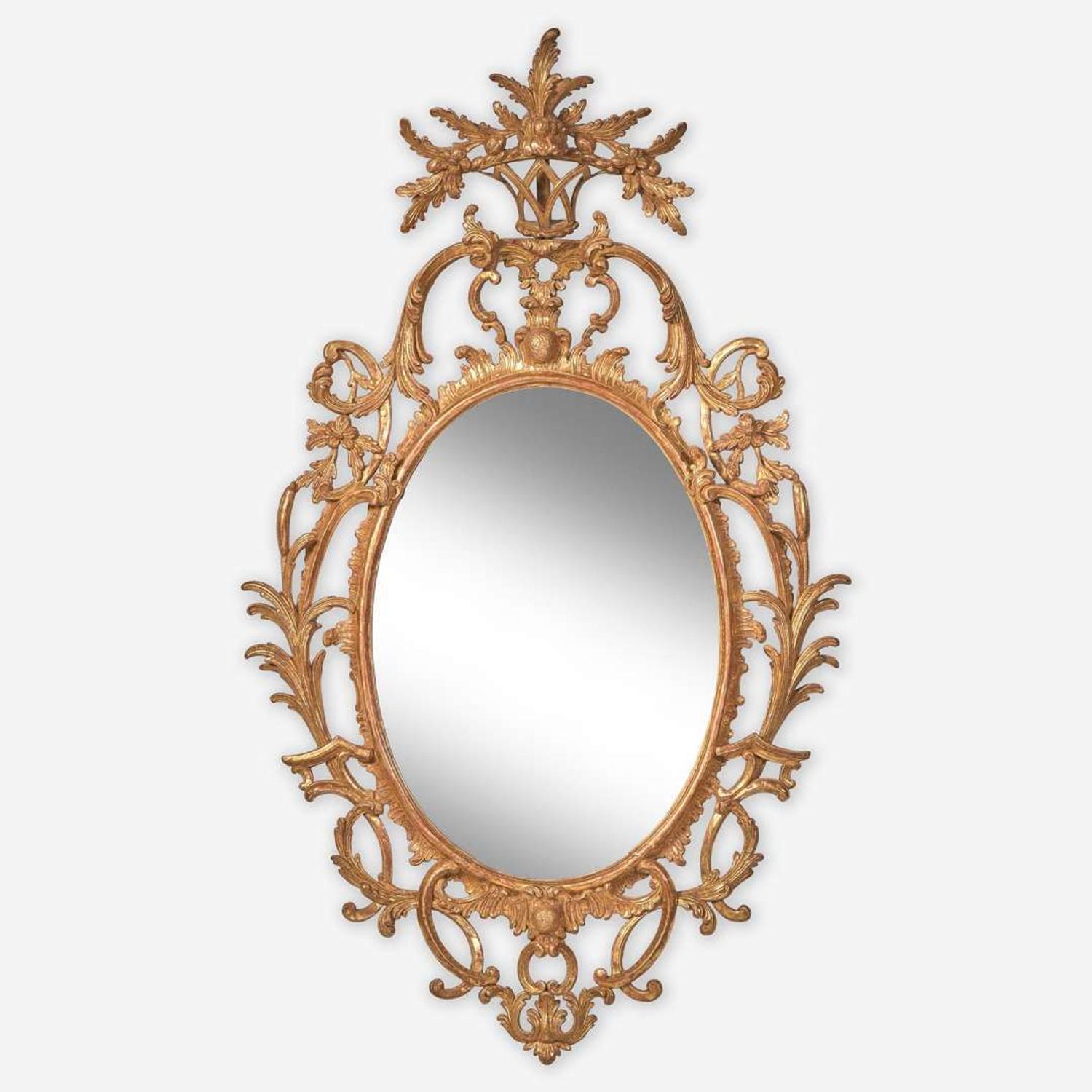 A rare Chippendale oval carved and gilded pine looking glass Probably English, circa 1760-1780